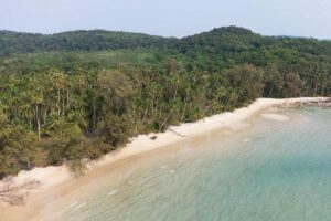 Scenic view of Ao Taphao Beach with clear water and sandy shore