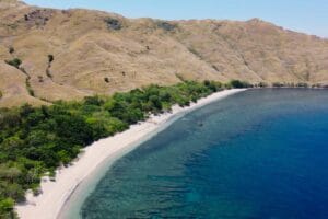 Talisayen Cove in Zambales, Philippines with white sand and clear blue water