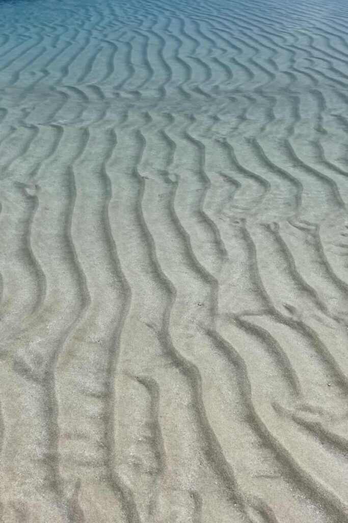 Soft white sand on Nain Island with clear water