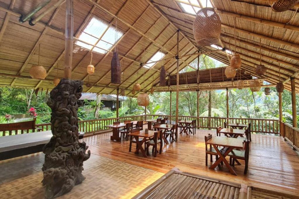 Rimba Eco Resort dining area with wooden tables